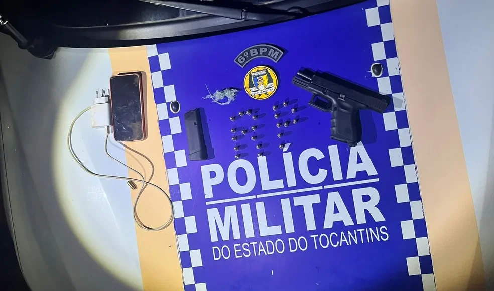 apreensão de armas , celular feito pela policia militar